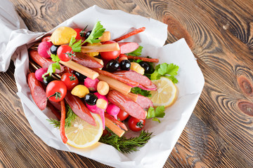 Smoked sausage, cheese, vegetables and greens, collected in a bouquet. Option gift man.