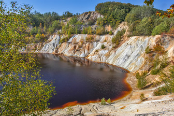 Black artificial lake and hills - mining and production of copper in Bor, Serbia