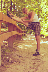 Hiker young woman in nature preparing to hike