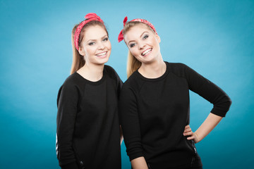 Two funny positive retro styled female portrait.