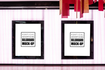 Two mock up vertical advertising billboard on the wall