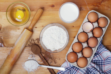 Food ingredients for baking: flour, eggs, milk, sugar