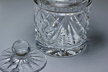 Macro abstract view of a beautiful vintage lead crystal glass jar and lid with hand-cut designs and facets