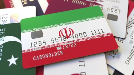 Many credit cards with different flags, emphasized bank card with flag of Iran - Powered by Adobe