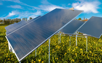 solar panels on a meadow of blooming dandelions.