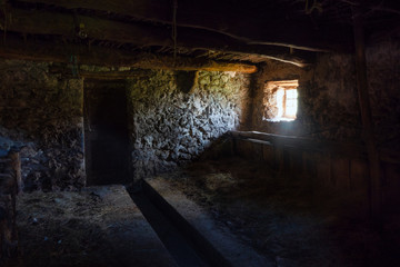Interior of an ancient rural stable in northern Italy