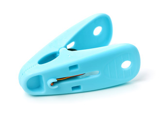 Closeup image of little colorful office clothespins isolated on a white background