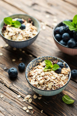 Mix of homemade cereal with blueberry and mint