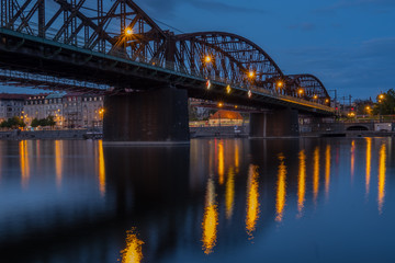 Fototapeta na wymiar Railway bridge and Vltava river at night. Prague, Czech Republic