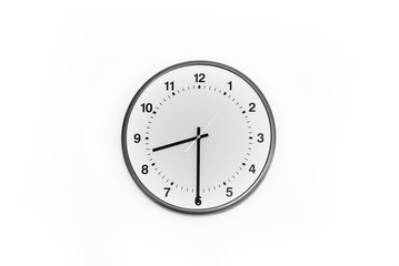 Wall clock on white background display at 8:30 am, which is the time to start working.