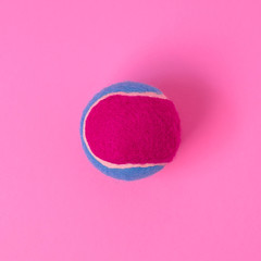 Pink tennis ball on pink background. Sports healthy lifestyle concept. Flat-lay illustration