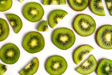 Sliced kiwi fruit on white background pattern