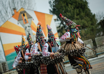 mummers perform rituals with costumes and big bells, intended to scare away evil spirits during the international festival of masquerade games  