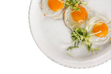 Fried egg on a white background. Isolated. View from above.