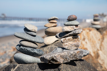 Fototapeta na wymiar Stack of Stones on the Beach, Cairn