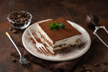 Tiramisu. Traditional italian dessert on white plate