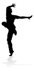 Fototapeta na wymiar A male street dance hip hop dancer in silhouette