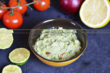 Mexican Guacamole in MolcajeteGuacamole prepared in a traditional volcanic stone bowl called molcajete
