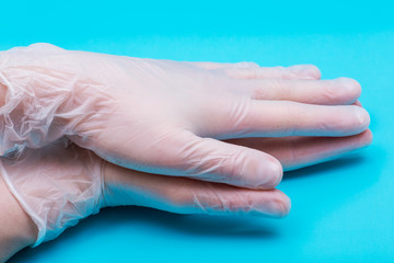 Medical Exam Quality Vinyl Gloves on colorful background.