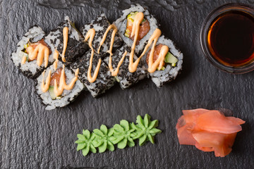 Smoked salmon roll sushi served on blackstone