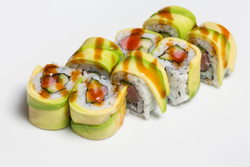 Salmon avocado sushi roll served on a plate © rilueda