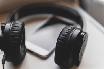 Smart phone and headset on train table