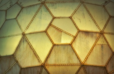 Yellow futuristic grungy wall panels made of geometric shapes