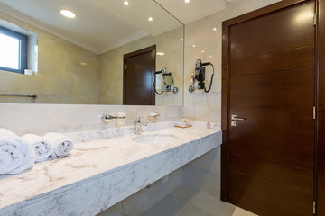 Hotel bathroom interior with shower cabin
