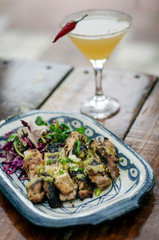 roast chicken with garlic and coriander sauce and pickled vegetables salad