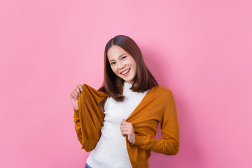 Cute Asian woman, she is holding a shirt.