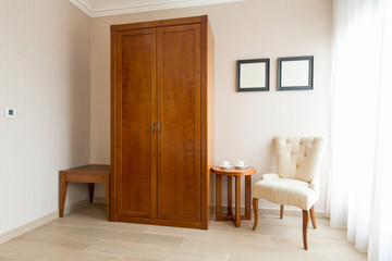 Fototapeta na wymiar Classic style wooden furniture in hotel room interior