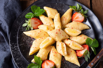 Kopytka - polish potato dumpling with strawberries