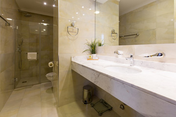 Hotel bathroom interior with shower cabin