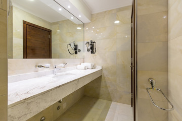 Hotel bathroom interior with shower cabin