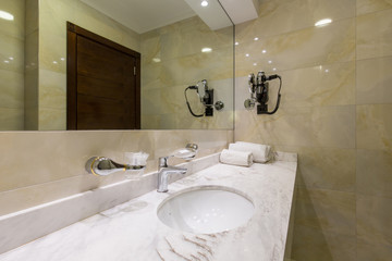 Hotel bathroom interior with shower cabin