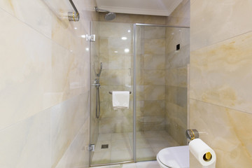 Hotel bathroom interior with shower cabin