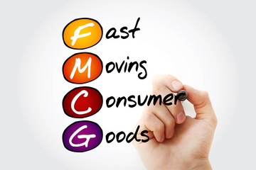 Fototapeta premium Hand writing FMCG - Fast Moving Consumer Goods acronym with marker, concept background