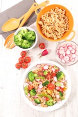 pasta with broccoli, radish and tomato