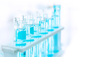 laboratory glassware with liquids of different colors, Laboratory tubes with blue liquid in the laboratory, available for scientists working in laboratories, tools for laboratory scientists.