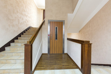 Hotel corridor with elevator and stairs
