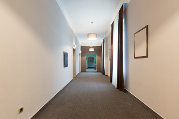 Interior of a hotel corridor with doors