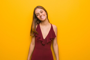 Young elegant woman wearing a dress cheerful with a big smile