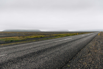 Empty road in foggy weather.