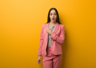 Young modern business woman pointing to the side