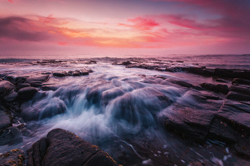 Sunrise at the tessellated rocks of Garie Beach Australia