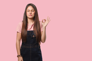 Young cool woman performing yoga