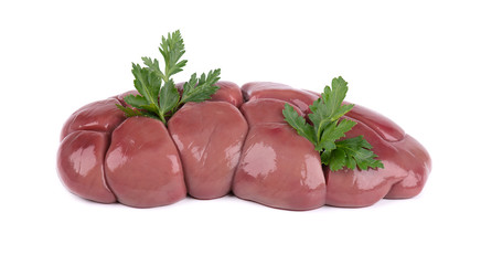 Beef kidney raw isolated on white background. Close Up. Cow kidney isolated with parsley leaves.