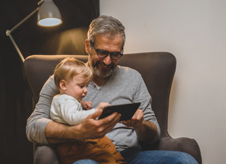 spending time with his grandson at home