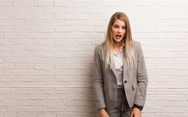 Young russian business woman screaming very angry and aggressive