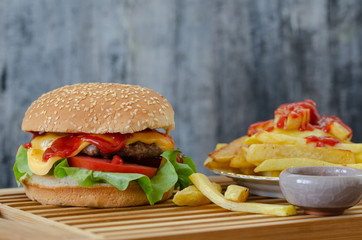 Homemade hamburger and potato fries.